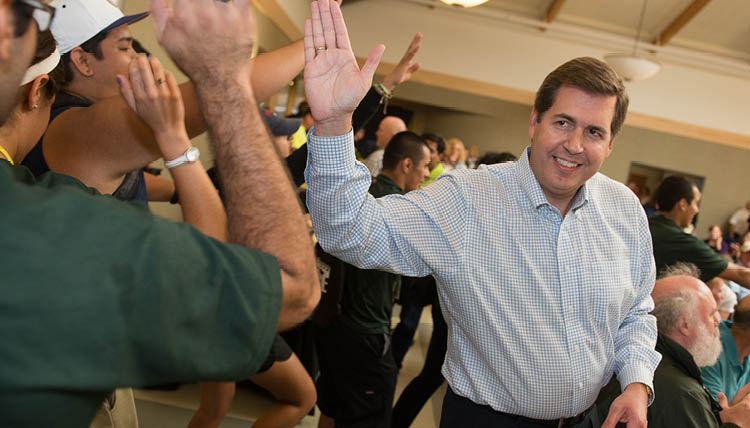 President McCulloh give high-fives.