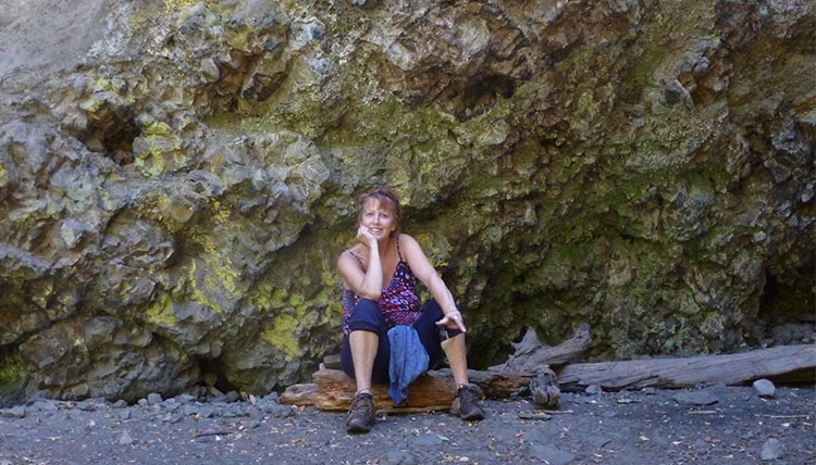 Woman sitting on mountain
