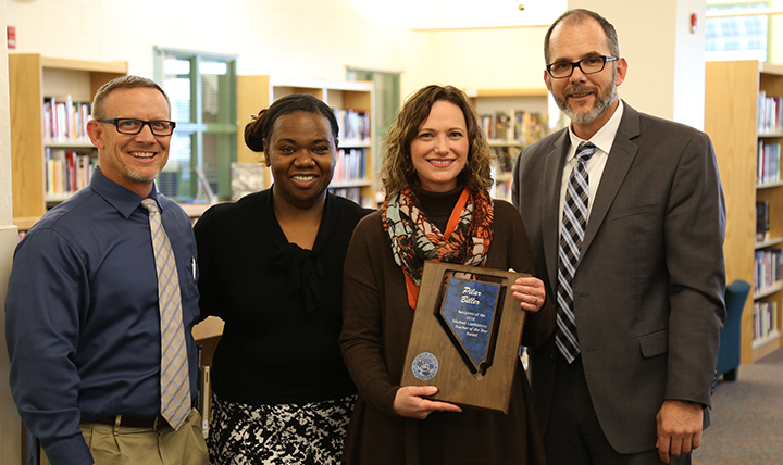 Pilar Biller poses after receiving her Teacher of the Year award. 