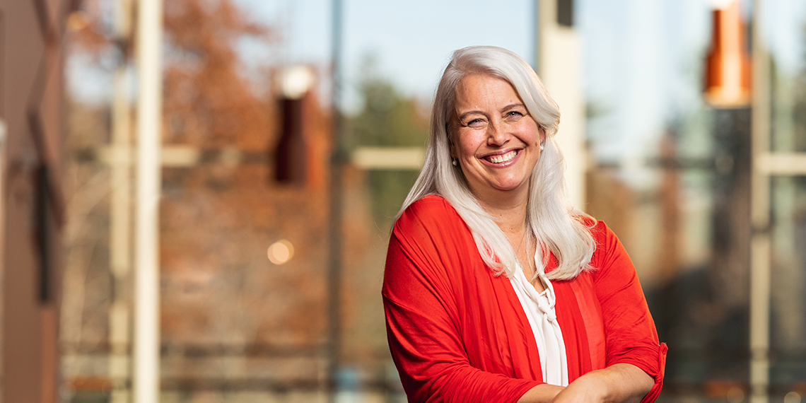 Suzanne Ostersmith standing in front of a blurred background of the Gonzaga Campus.
