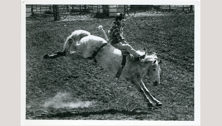 black and white image of a person on a horse