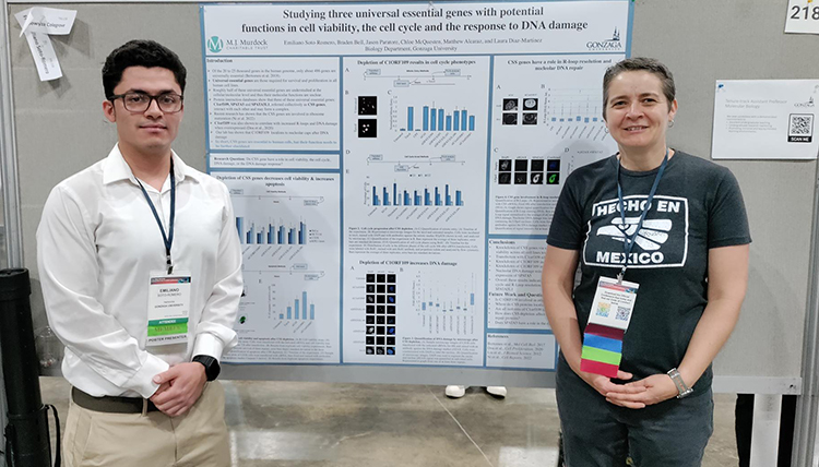 Gonzaga biology student Emiliano Soto-Romero and biology professor Laura Diaz Martinez stand in front of Emiliano's research poster. 