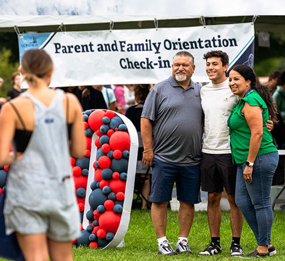 A family poses for a photo together on Move-in Day
