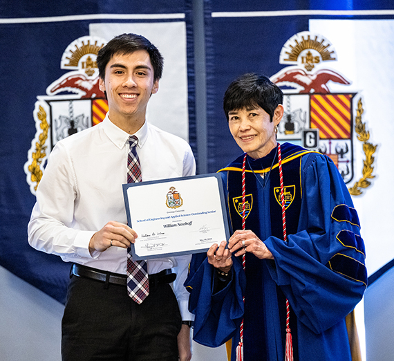SEAS Dean Karlene Hoo gives a student an award