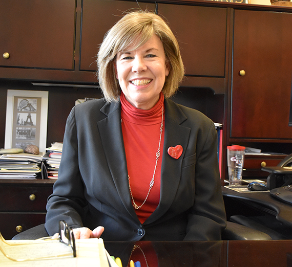 Maureen McGuire sitting at a desk
