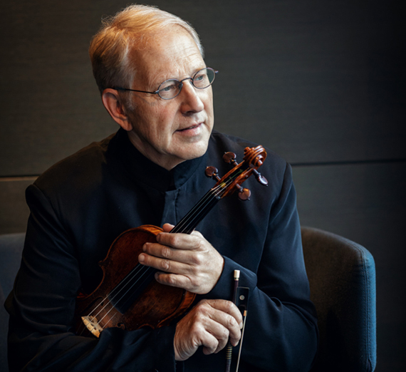Violinist Shlomo Mintz holding a violin