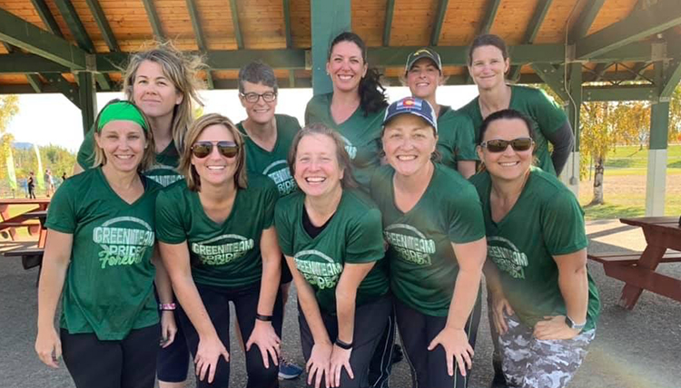 ten women in green tshirts