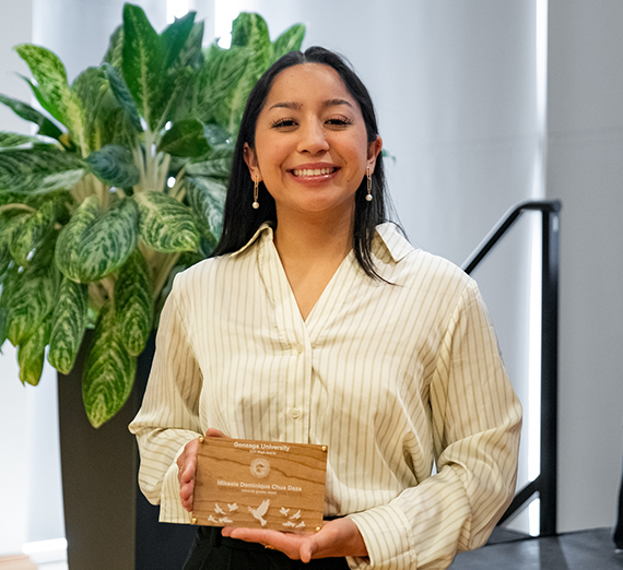 Mikaela Dominique Chua Daza smiling and holding the University Ignatian Award at Gonzaga University Magis Awards. 