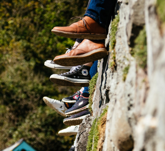 Feet dangling off ledge