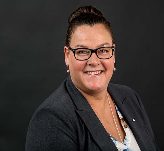 headshot of Zeisner in photo studio
