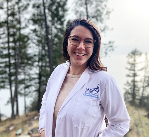 Women poses in nursing jacket.