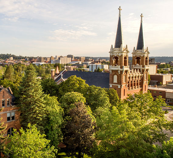 The St. Aloysius spires against a blue sky