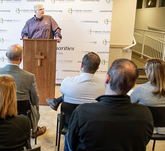 Rob McCann, Catholic Charities, at press conference.