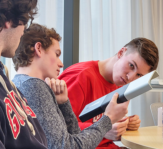students check out a composite item