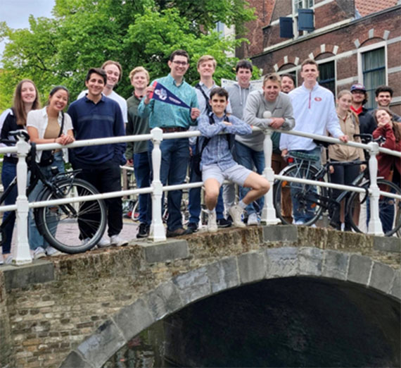 Gonzaga in Delft students on a bridge in the Netherlands.