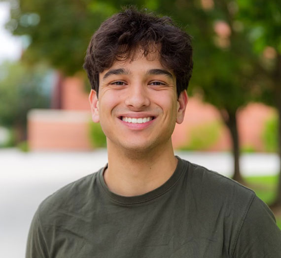 Student Gus Ringo ('24) smiles into the camera