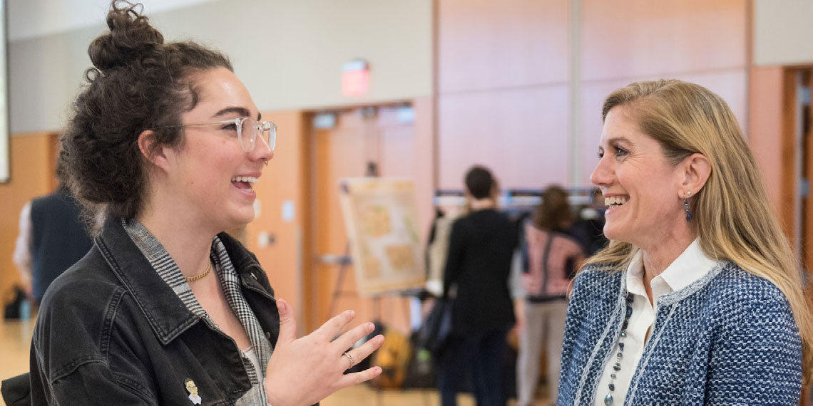 Mia Bertagnolli listens to speaker