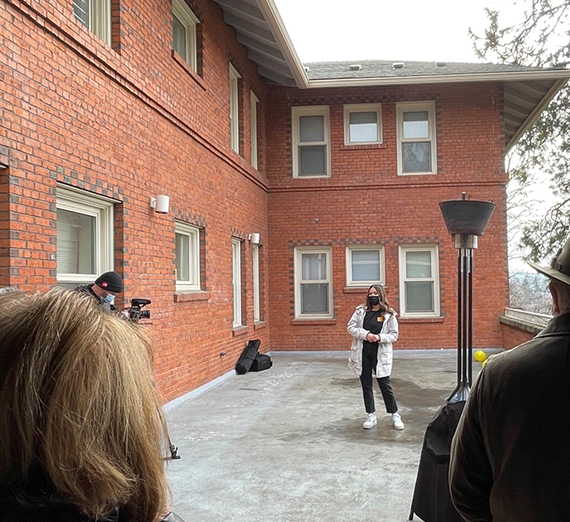 Student speaking in front of crowd