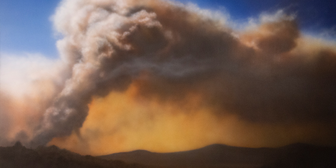 A painting of a mountain top on fire by Samantha Fields