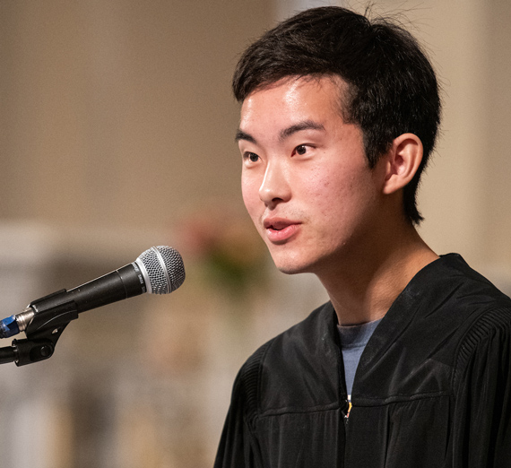 Senior Kainoa Evans speaking at the Academic Convocation.