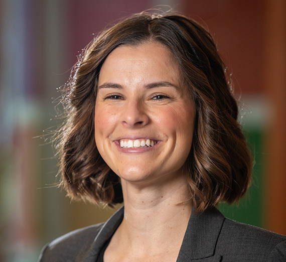 A smiling woman with short brown hair