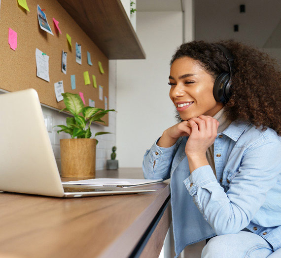 A woman working on a laptop.