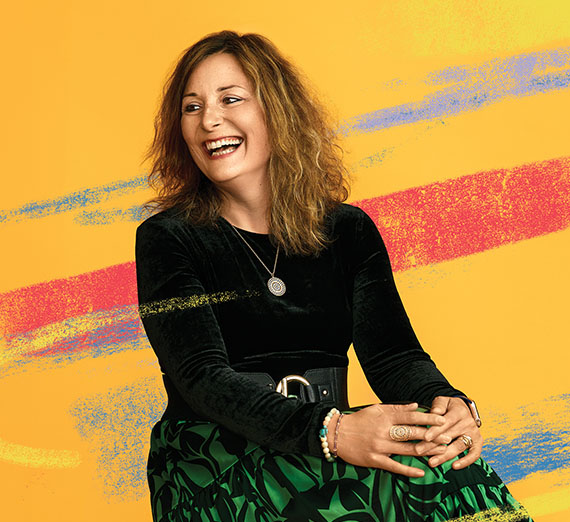 woman in black against yellow vibrant background