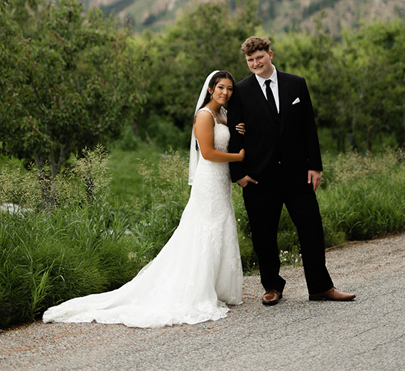 ’22, ’23 Taylor Takasugi and Dylan Parrish's wedding portrait.