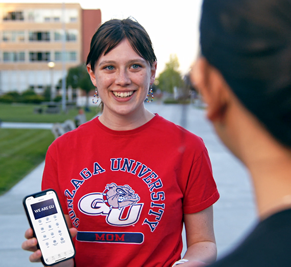 A student uses the GU Mobile App.