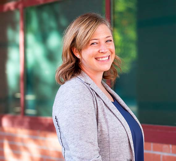 Portrait of Molly Ayers standing outside