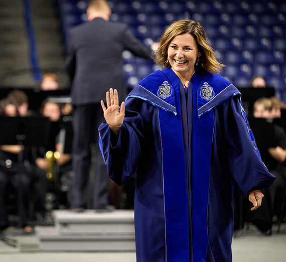 Passerini waving at attendees at her inauguration.