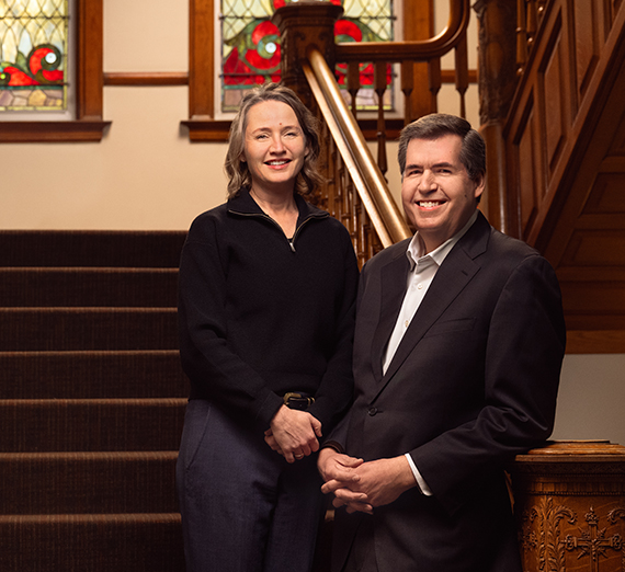 Thayne and Julie on a staircase.