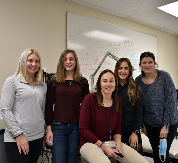 Women in the STEM field pose for a picture
