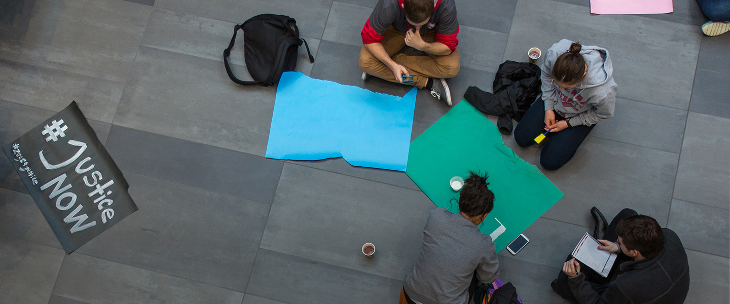 Students make signs for the Martin Luther King Day march.