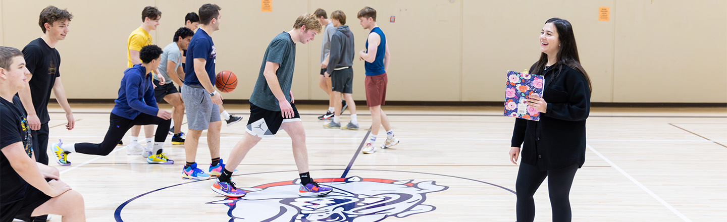 student facilitating pe class