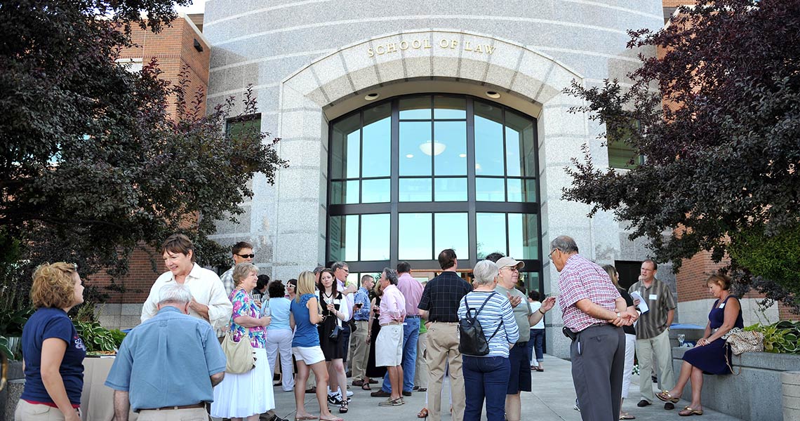 Front of Gonzaga Law School with many people walking around.