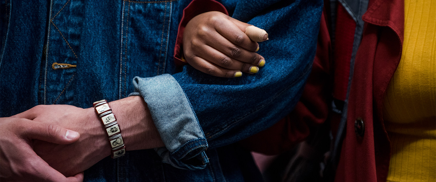 close up of linked arms